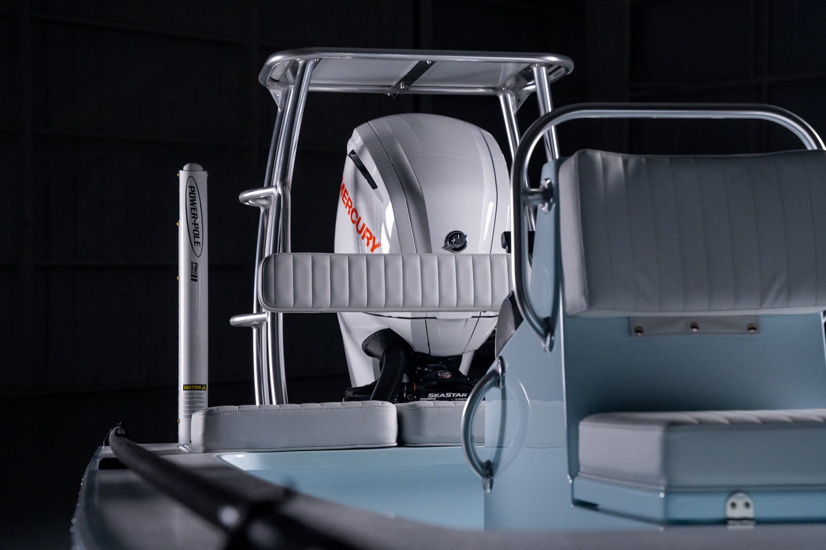White Mercury outboard under the T-top, with the Power-Pole and leaning post